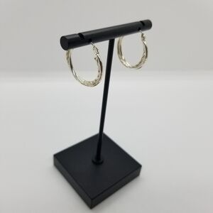 silver tone textured twist hoop earrings